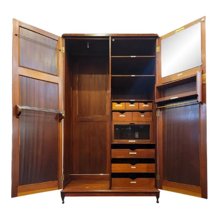 Circa 1920s Arighi, Bianchi & Co. Verithing Mahogany Compactum Gentleman's Wardrobe fitted with drawers, racks, shelves, and cabinets.
