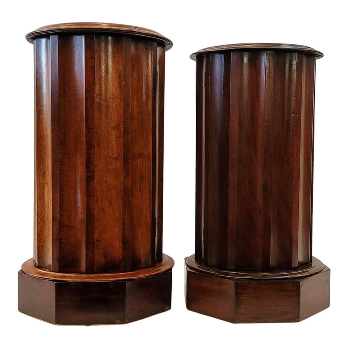 Two bedside cabinets from Victorian England in the architectural shape of fluted columns on octagonal plinth bases. 