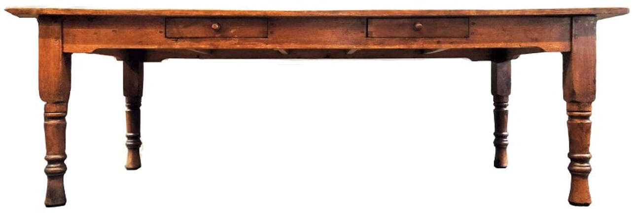 Classic 19th-century type kitchen work table is in a form favored in the Victorian decades of the 1850s through the 1880s.  The table is constructed with wooden pegs and pine wood - one of the woods known as 